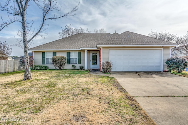 ranch-style home with a garage and a front yard