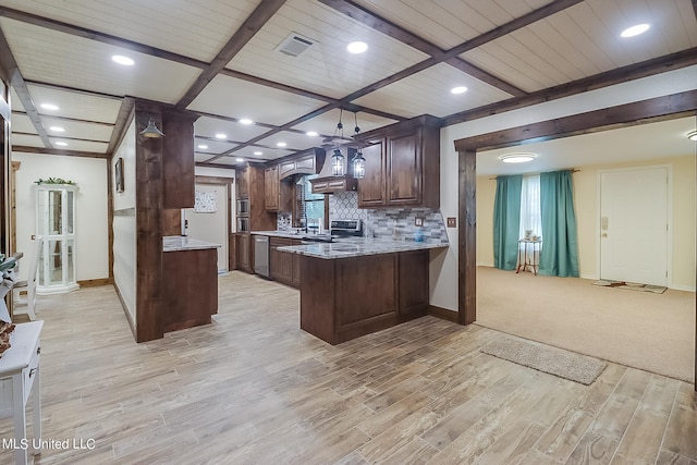 kitchen featuring beamed ceiling, light hardwood / wood-style flooring, kitchen peninsula, backsplash, and appliances with stainless steel finishes