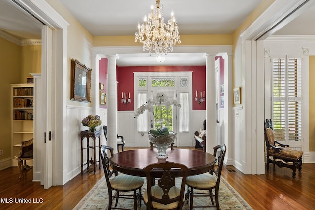 315 N St, Lexington, MS 39095 - dining space with a wainscoted wall, wood finished floors, and decorative columns