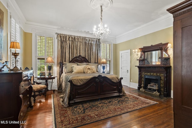 315 N St, Lexington, MS 39095 - bedroom with multiple windows, wood finished floors, and a notable chandelier