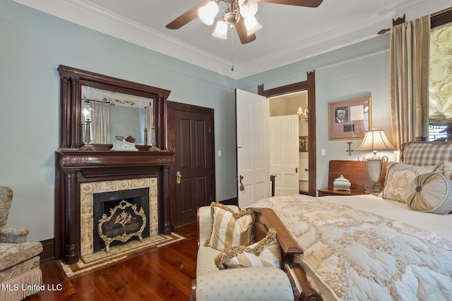 315 N St, Lexington, MS 39095 - bedroom with ceiling fan, a fireplace, ornamental molding, and dark wood-style floors