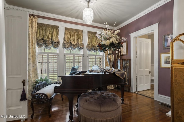 315 N St, Lexington, MS 39095 - sitting room with baseboards, a wealth of natural light, a chandelier, and wood finished floors