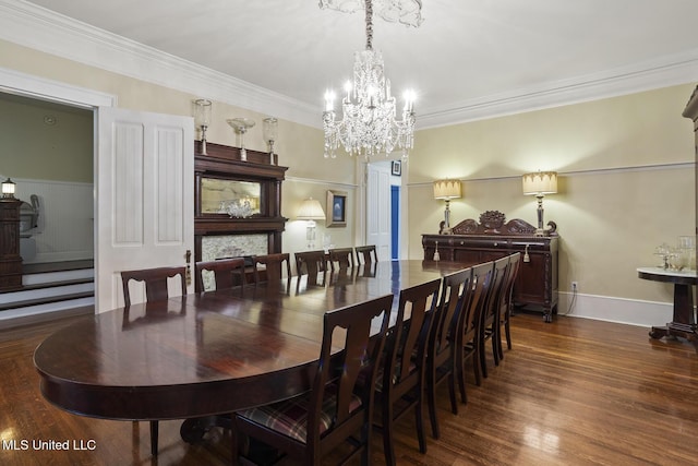 315 N St, Lexington, MS 39095 - dining area with baseboards, a notable chandelier, crown molding, and dark wood-style floors