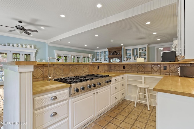 315 N St, Lexington, MS 39095 - kitchen featuring a ceiling fan, recessed lighting, stainless steel gas cooktop, wooden counters, and tasteful backsplash