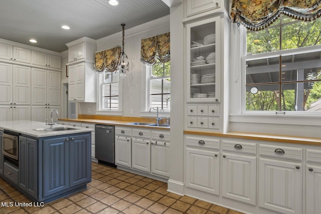 315 N St, Lexington, MS 39095 - kitchen with light countertops, white cabinets, appliances with stainless steel finishes, and a sink