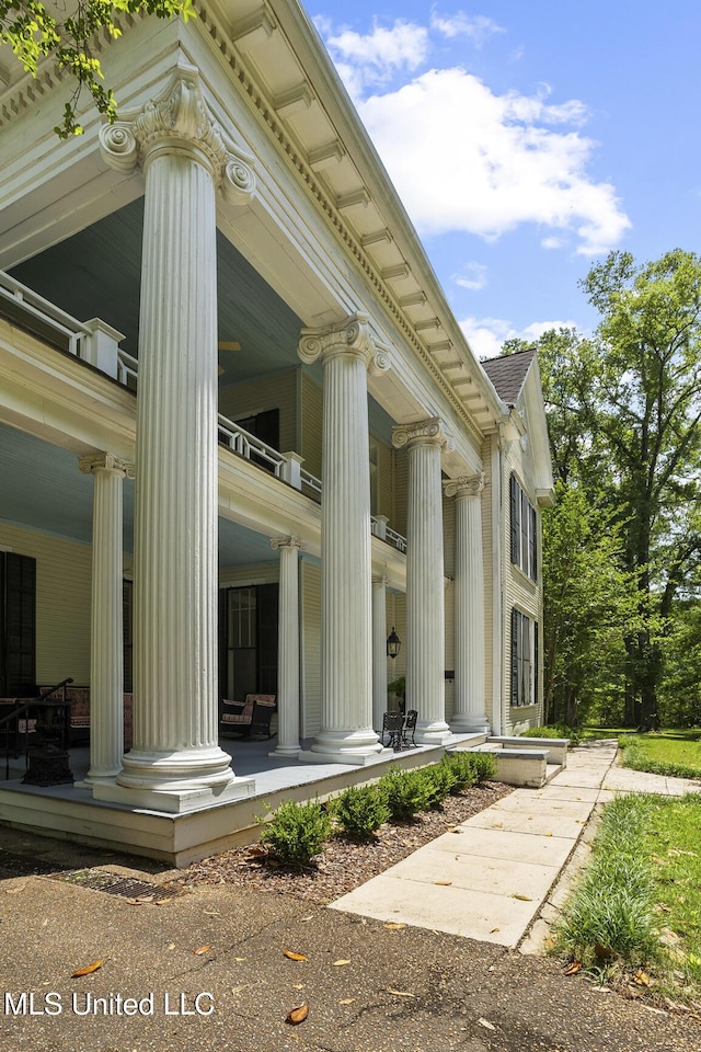 315 N St, Lexington, MS 39095 - view of side of property with a porch and a balcony