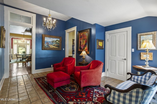 315 N St, Lexington, MS 39095 - living area with baseboards, a notable chandelier, and vaulted ceiling