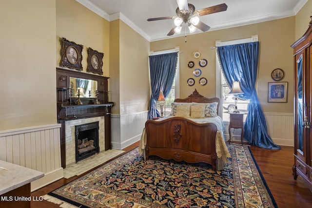315 N St, Lexington, MS 39095 - bedroom with wainscoting, ornamental molding, multiple windows, and wood finished floors
