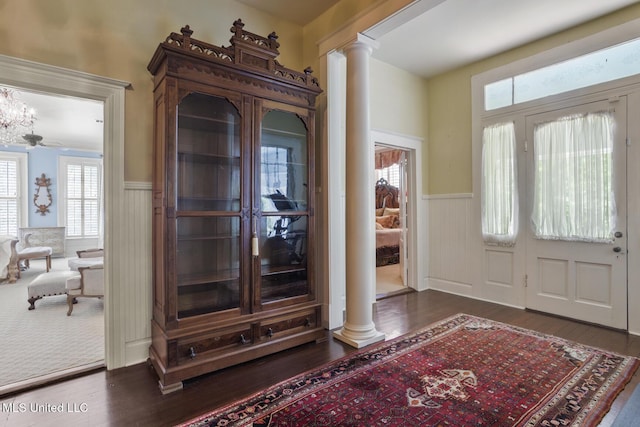 315 N St, Lexington, MS 39095 - entryway with wainscoting, ornate columns, and dark wood finished floors