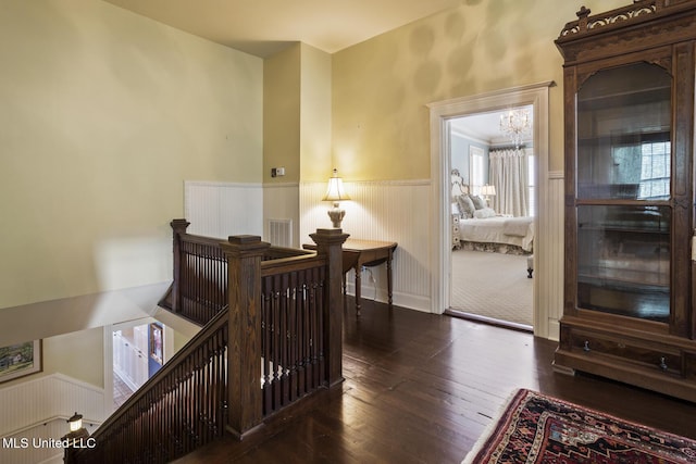 315 N St, Lexington, MS 39095 - interior space featuring a chandelier, wood-type flooring, a wainscoted wall, and visible vents