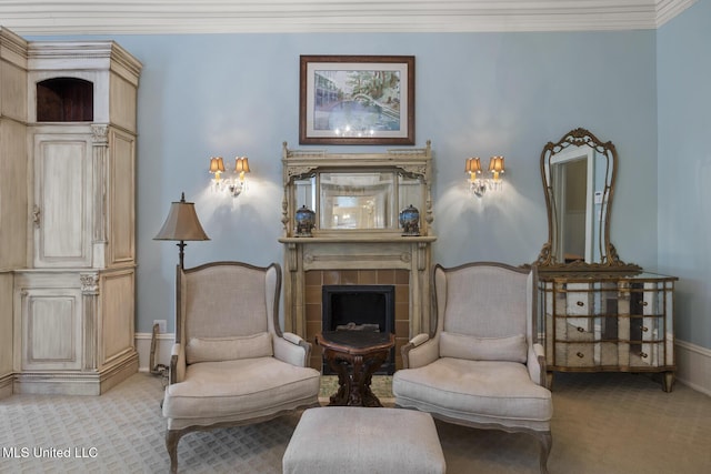 315 N St, Lexington, MS 39095 - sitting room with baseboards, a tile fireplace, ornamental molding, and carpet