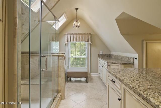 315 N St, Lexington, MS 39095 - bathroom featuring a stall shower, tile patterned flooring, vanity, a chandelier, and vaulted ceiling