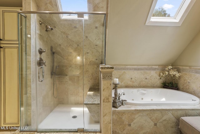 315 N St, Lexington, MS 39095 - bathroom with a stall shower, a skylight, and a whirlpool tub