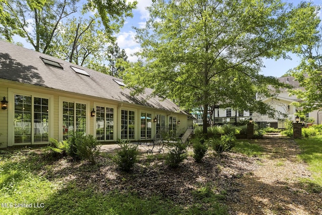 315 N St, Lexington, MS 39095 - rear view of house featuring roof with shingles
