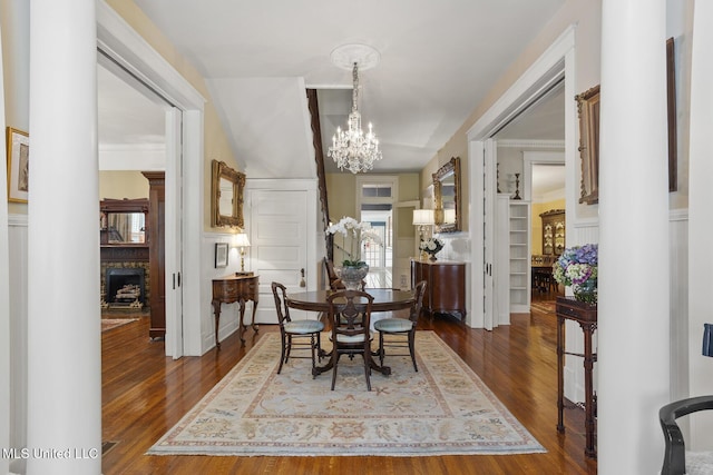 315 N St, Lexington, MS 39095 - dining space with dark wood-style flooring, a notable chandelier, and a fireplace