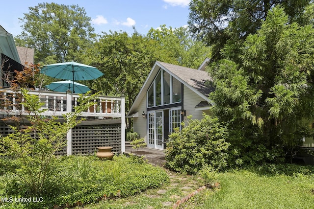 315 N St, Lexington, MS 39095 - rear view of house featuring roof with shingles, french doors, and a wooden deck