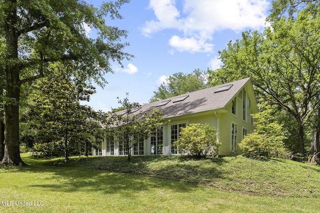 315 N St, Lexington, MS 39095 - view of home's exterior with a yard and a shingled roof