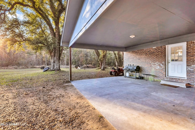 view of patio featuring a grill