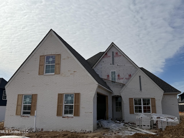 view of front of house featuring brick siding