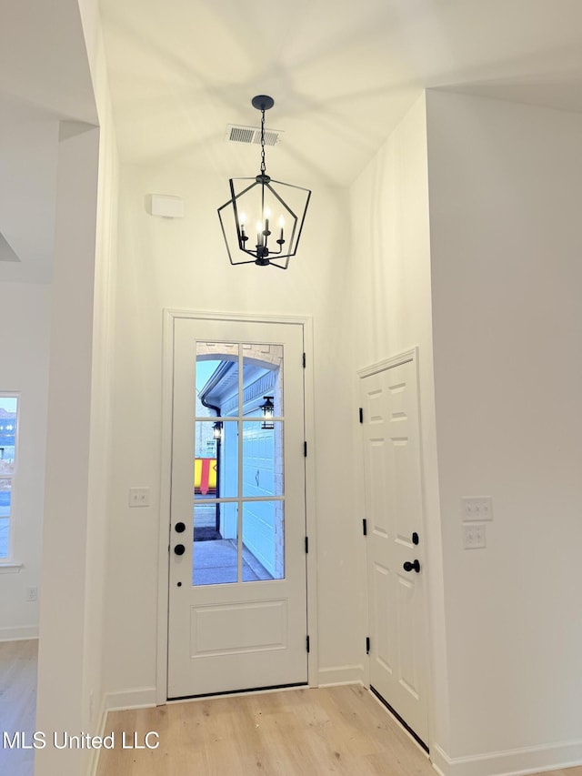 3165 Winterwood Dr, Hernando, MS 38632 - foyer featuring an inviting chandelier, light wood-style floors, visible vents, and baseboards