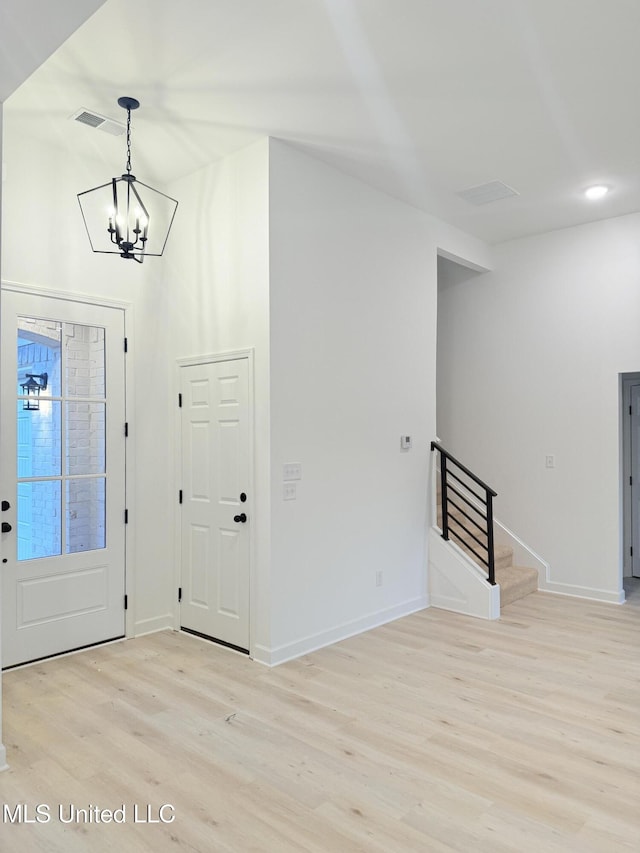 3165 Winterwood Dr, Hernando, MS 38632 - entryway with stairway, light wood-style flooring, baseboards, and visible vents