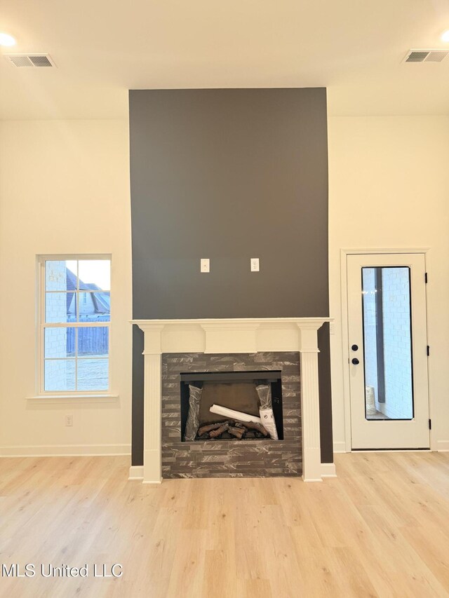 3165 Winterwood Dr, Hernando, MS 38632 - interior details with a stone fireplace, wood finished floors, and visible vents