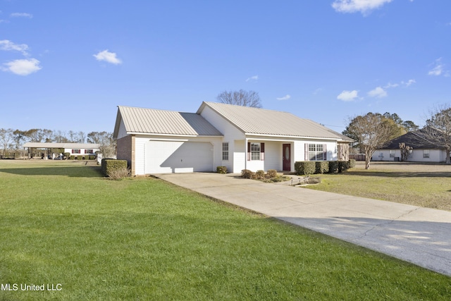 view of front of house with a garage and a front yard