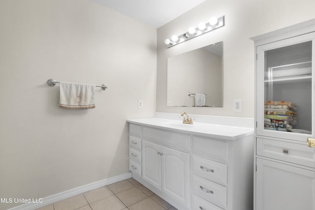 bathroom with tile patterned flooring and vanity