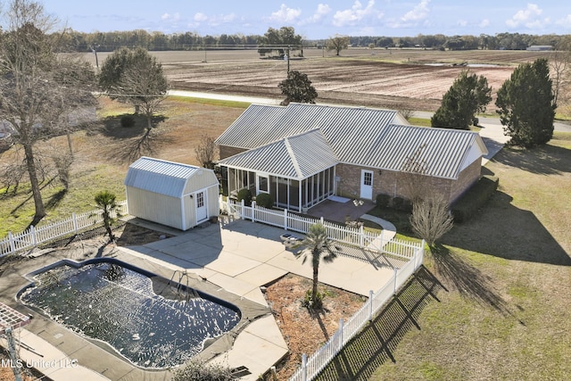 birds eye view of property with a rural view