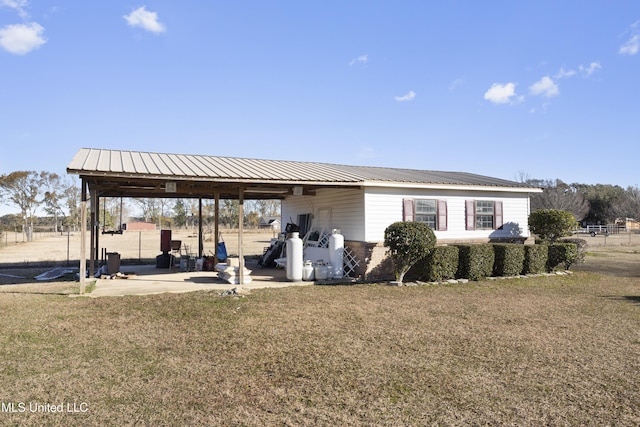 exterior space with a yard and a patio area