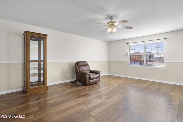 unfurnished room with hardwood / wood-style flooring and ceiling fan