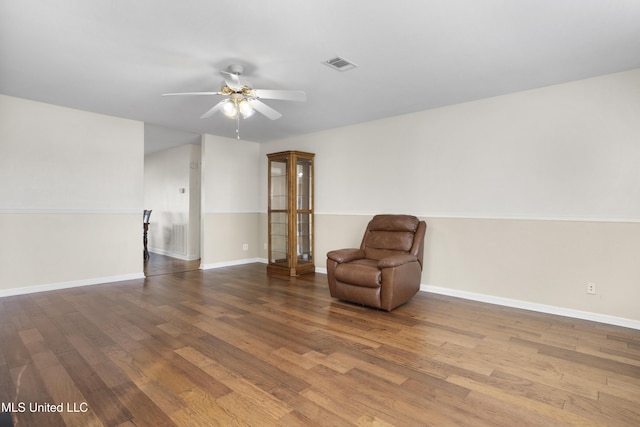 unfurnished room featuring hardwood / wood-style flooring and ceiling fan