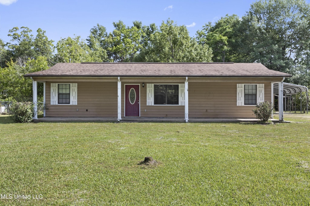 ranch-style home with covered porch and a front lawn