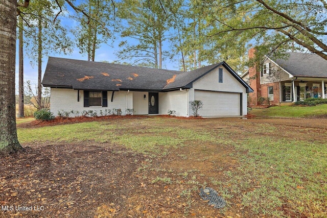 single story home with a front yard and a garage