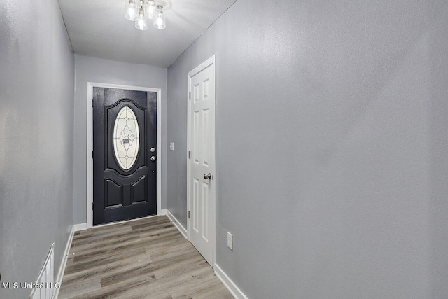 doorway to outside with light hardwood / wood-style floors