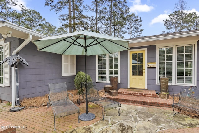 doorway to property featuring a patio area