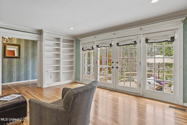 interior space with french doors, wood finished floors, visible vents, and recessed lighting