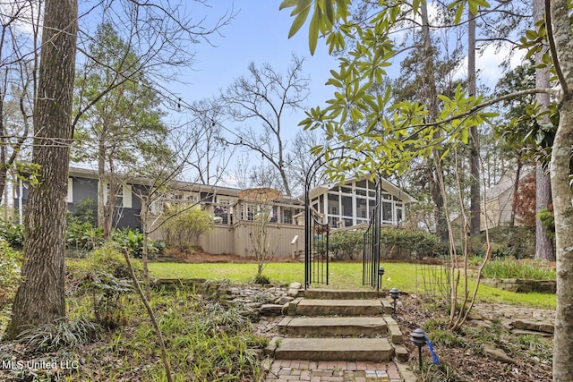 view of yard featuring a sunroom