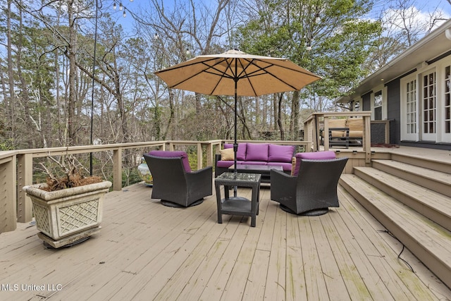 wooden deck featuring an outdoor hangout area