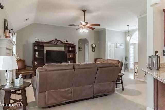 living room with ornamental molding, lofted ceiling, and ceiling fan