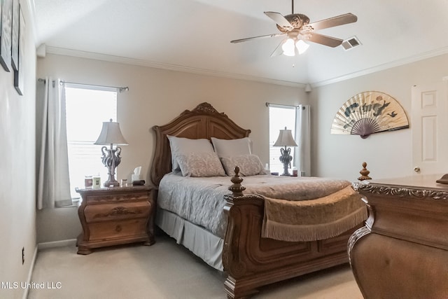 carpeted bedroom featuring ornamental molding and ceiling fan