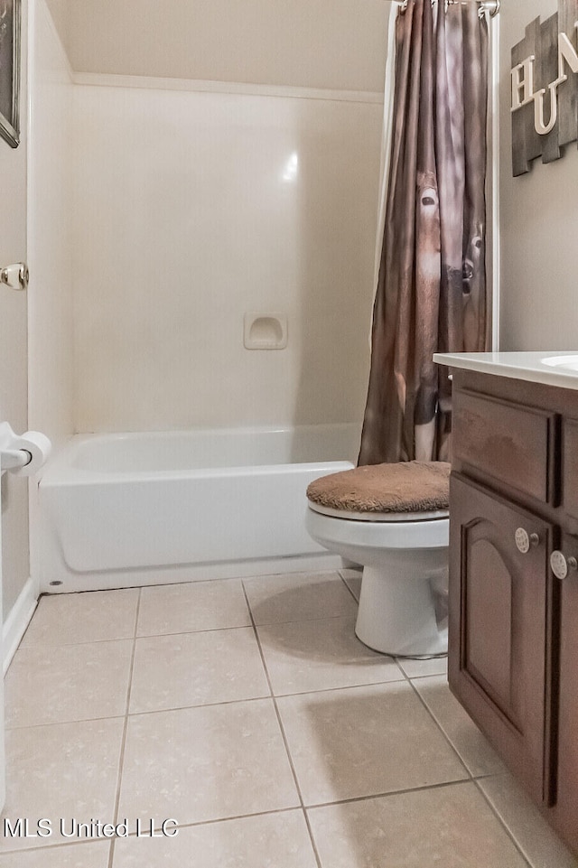 full bathroom with tile patterned flooring, vanity, toilet, and shower / tub combo