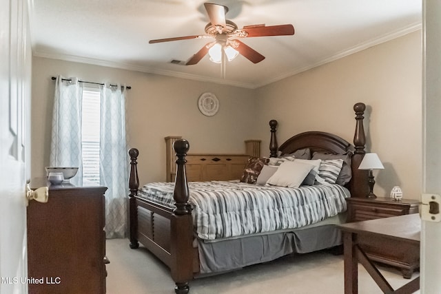 bedroom featuring ornamental molding, light colored carpet, and ceiling fan