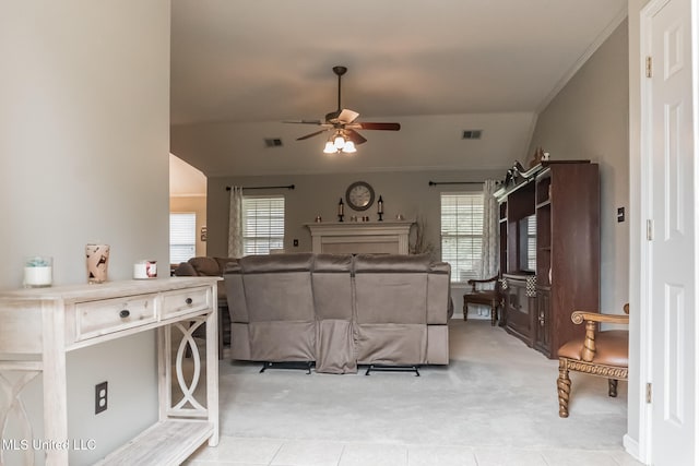 bedroom with ornamental molding, vaulted ceiling, light tile patterned floors, and ceiling fan