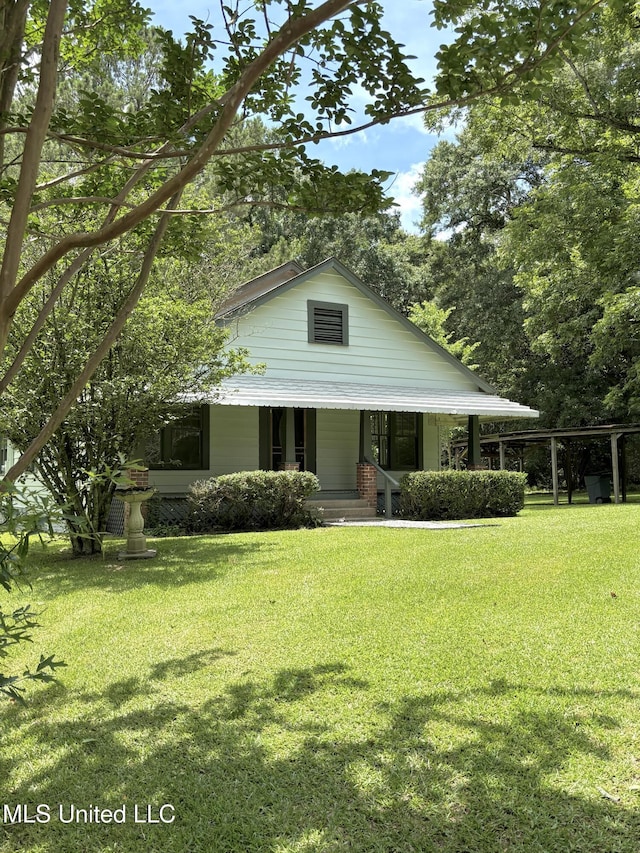 873 SCR 142, Morton, MS 39117 - view of front facade with covered porch and a front yard