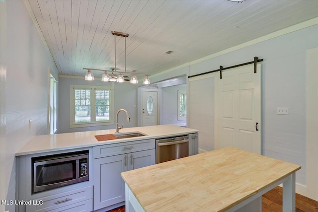 873 SCR 142, Morton, MS 39117 - kitchen with appliances with stainless steel finishes, a kitchen island, wooden ceiling, butcher block countertops, and a barn door