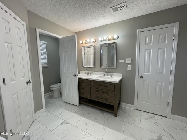 full bath featuring baseboards, a sink, and marble finish floor