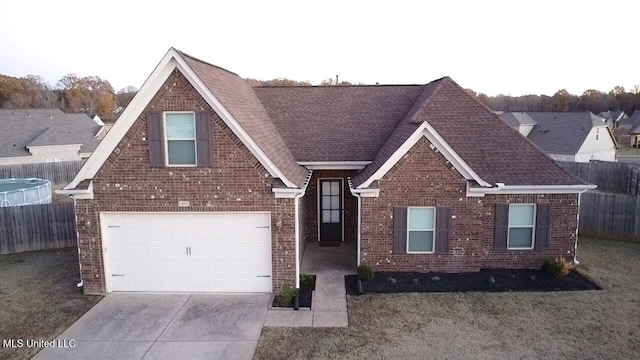 view of front of property featuring a garage