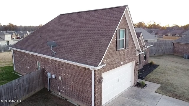 view of property exterior featuring a garage