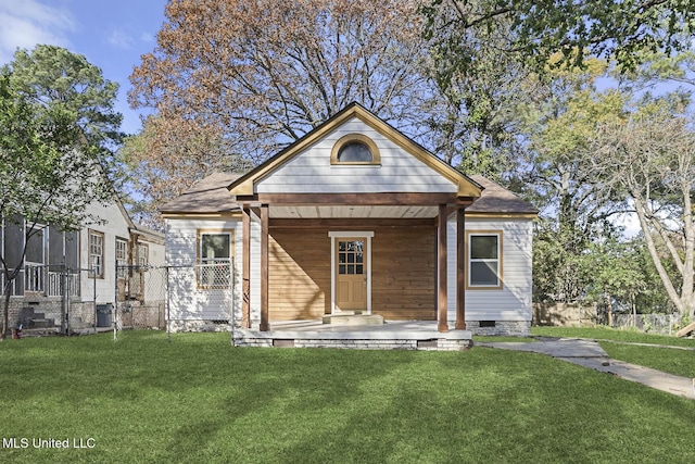 bungalow-style home with a porch and a front lawn